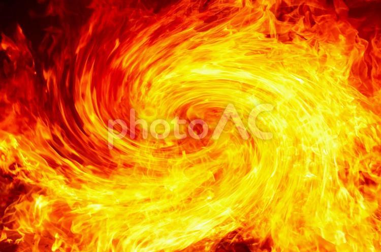 うねりながら迫る炎の背景画像 炎,火,炎上の写真素材