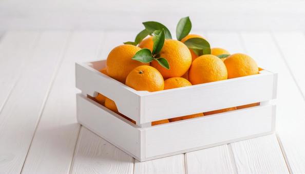 箱に入ったオレンジの写真