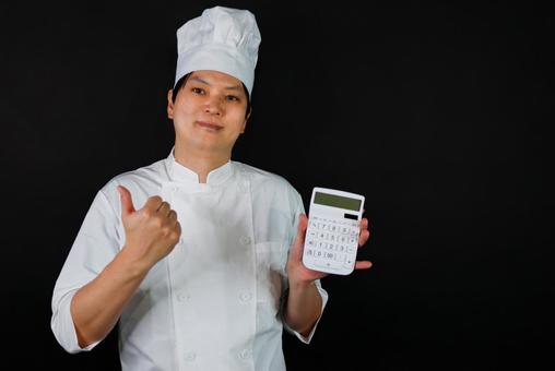 計算機を持つシェフ シェフ,料理人,帽子の写真素材