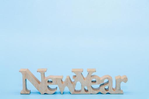 水色背景にニューイヤーの文字 水色背景にニューイヤーの文字の写真