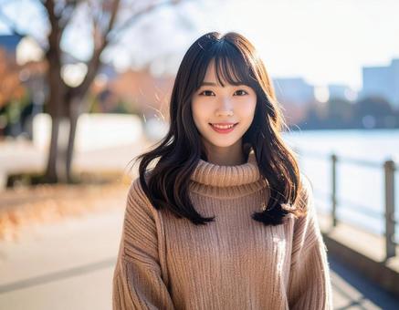 冬・セーター姿の彼女は笑顔 冬・セーター姿の彼女は笑顔の写真