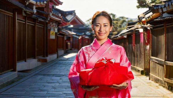 年末にお歳暮を持って挨拶に行くイメージ 年末にお歳暮を持って挨拶に行くイメージの写真