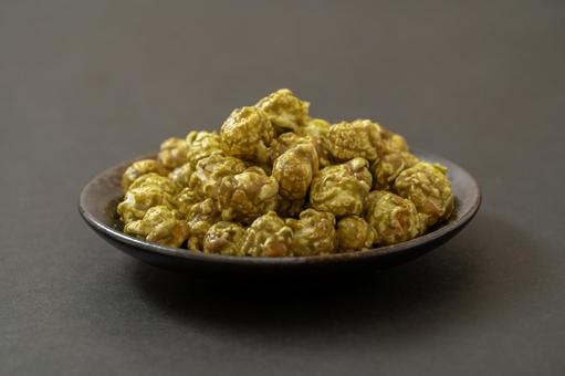 Matcha popcorn on a simple black background, JPG