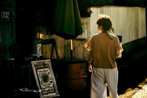 <Material> A woman strolling around a tourist spot at dusk, JPG