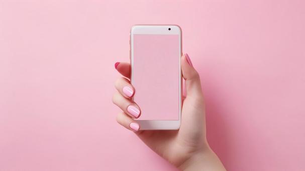 カラフルな背景にスマホを持つ女性の手4の写真