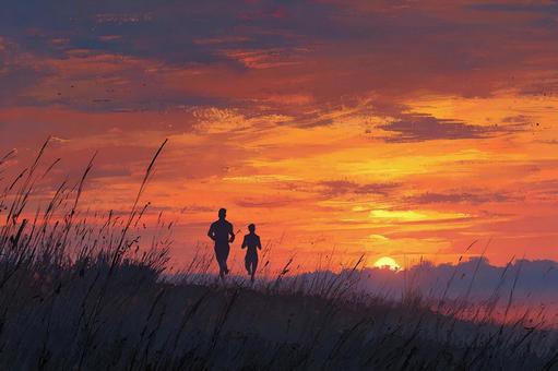 夕焼け空を走る二人 夕焼け空を走る二人の写真