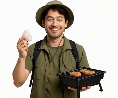 ごはんを持つアウトドアスタイルの笑顔男性 ごはんを持つアウトドアスタイルの笑顔男性の写真