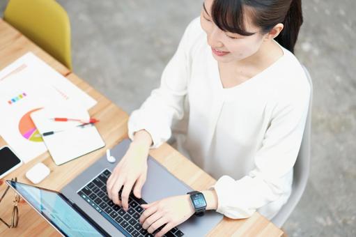 A woman working in a casual space, female, telework, pc, JPG