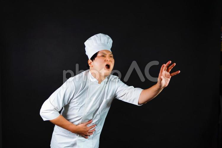 腹痛に苦しむシェフ シェフ,腹痛,痛みの写真素材