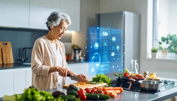 ホログラムレシピを見ながら料理する高齢者 ホログラムレシピを見ながら料理する高齢者の写真