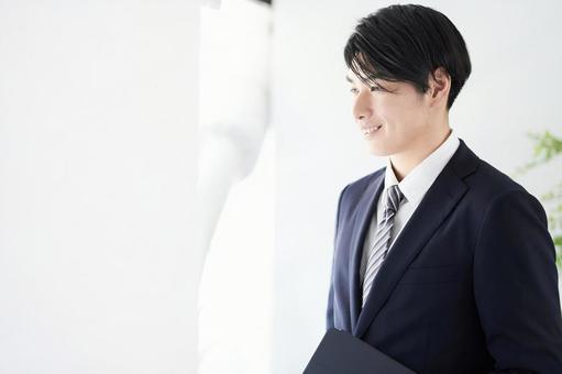 Japanese male businessman looking out the window with a smile, JPG Japanese male businessman looking out the window with a smile, a smile, male, businessman, JPG