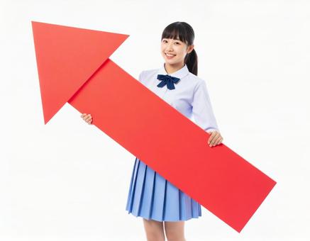 上向きの矢印を持つ女子生徒 上向きの矢印を持つ女子生徒の写真