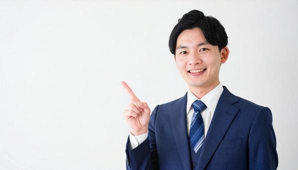 スーツ姿の若い男性・人差し指を立てている スーツ姿の若い男性・人差し指を立てているの写真