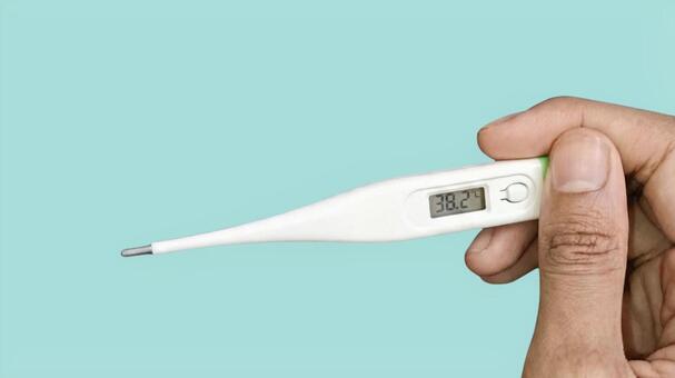 発熱症状 38.2℃のデジタル体温計 体温,高熱,発熱の写真素材