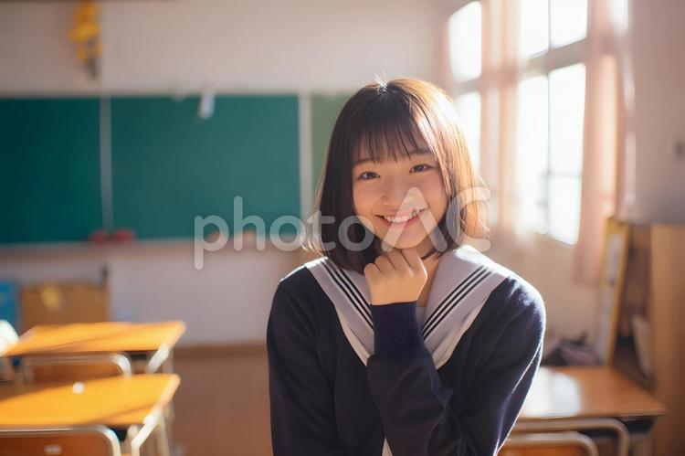 セーラー服の女子学生の教室での微笑み セーラー服,女子学生,微笑みの写真素材