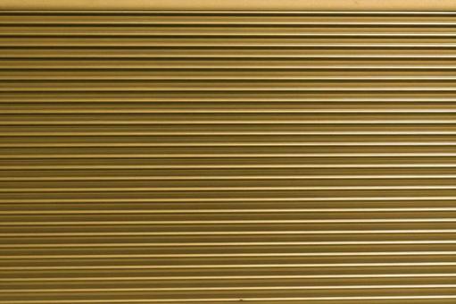 【背景素材】金属表面、ゴールドの写真