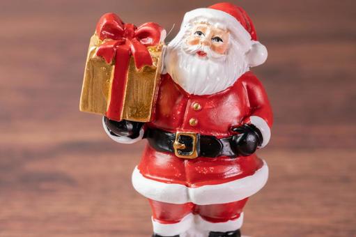 サンタ人形と金色プレゼント サンタクロース,人形,置物の写真素材