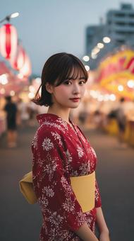夜祭に遊びに来た赤い浴衣の女性 夜祭に遊びに来た赤い浴衣の女性の写真
