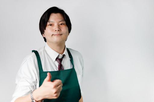 エプロン姿の男性の笑顔 エプロン姿の男性の笑顔 男性,笑顔,エプロンの写真素材