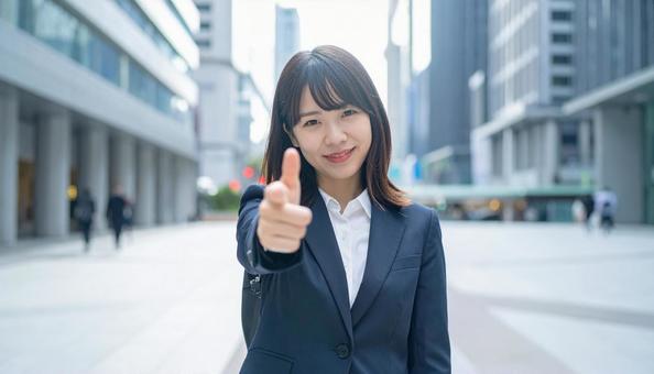 指をさす女性 指をさす女性の写真