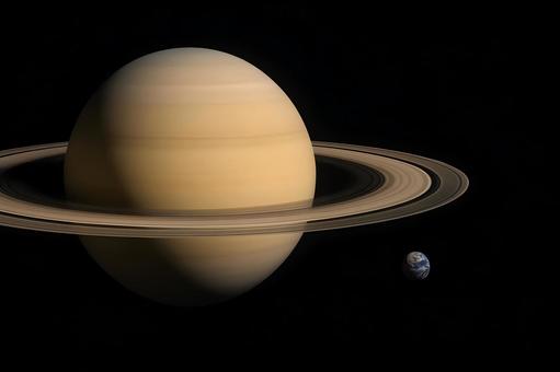 土星と地球の比較の写真