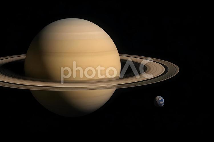 土星と地球の比較 土星,地球,サイズ比較の写真素材