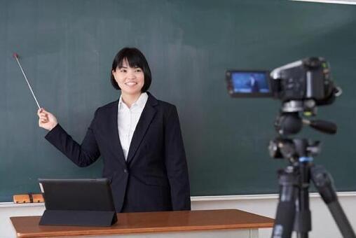 Japanese female teacher shooting online lessons in the classroom Japanese female teacher shooting online lessons in the classroom