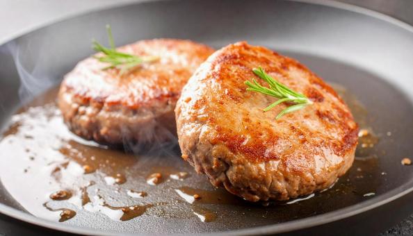 黒毛和牛ハンバーグ　湯気　肉汁の写真