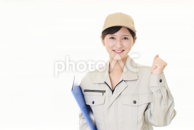 ガッツポーズの女性労働者 女性,女,作業員の写真素材