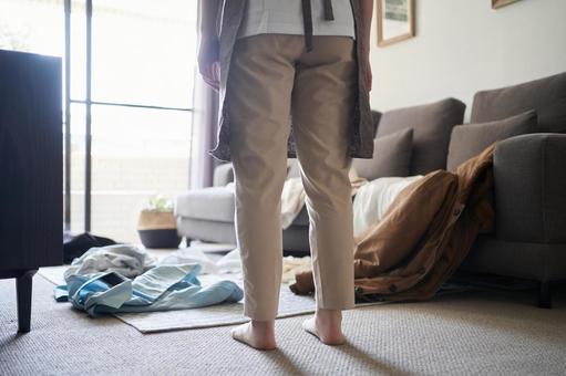 Asian woman cleaning up clothes she took off, housekeeping acting, clothes, put away, JPG