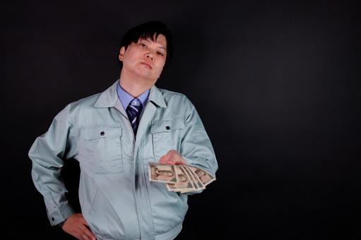 お金を差し出す男性労働者 お金を差し出す男性労働者 男性,労働者,お金の写真素材