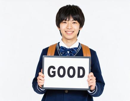 GOODと書いたボードをもつ生徒 GOODと書いたボードをもつ生徒の写真