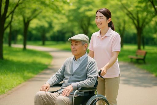 車椅子介助で公園散歩 車椅子介助で公園散歩の写真