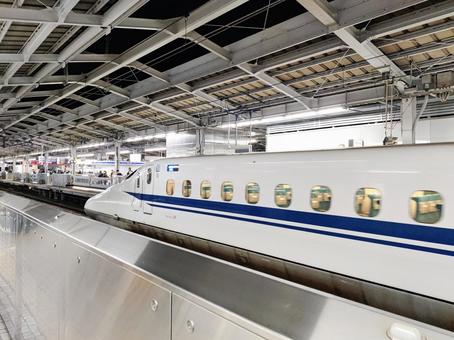 Shinkansen train parked at the station platform, JPG