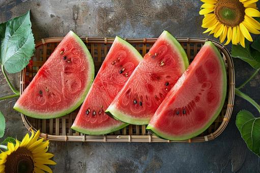 夏を感じるカットスイカとひまわりの写真の写真