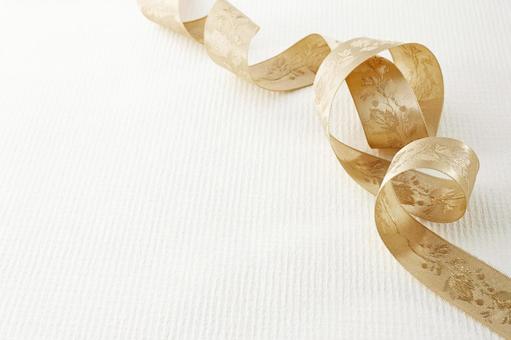 背景素材　金色リボン 背景素材,ゴールド,リボンの写真素材