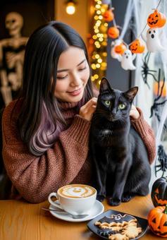 ハロウィンの猫カフェで黒猫を撫でる女性  ハロウィンの猫カフェで黒猫を撫でる女性の写真