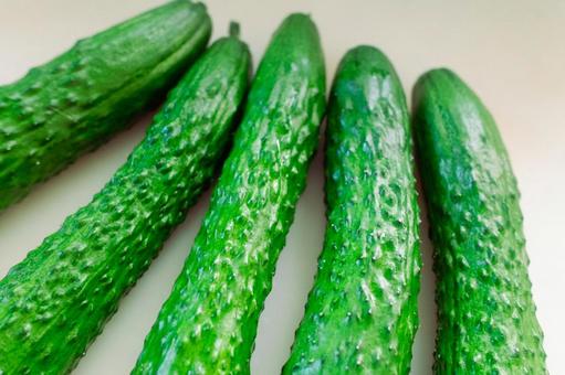 Close-up of bumpy cucumbers nestled together, JPG