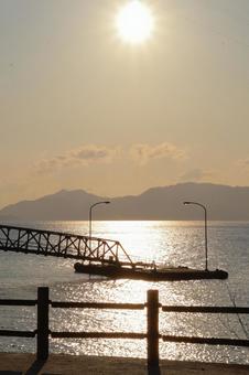 Pier lit by the morning sun, JPG