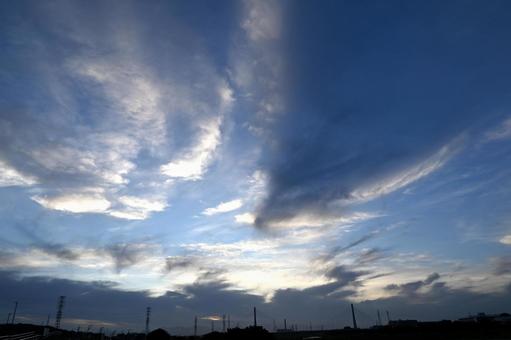Clouds brightening in the afterglow after sunset, JPG
