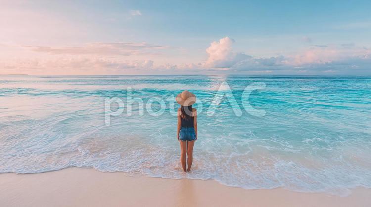 波打ち際で海を眺める女性の後ろ姿 女性,後ろ姿,ビーチの写真素材