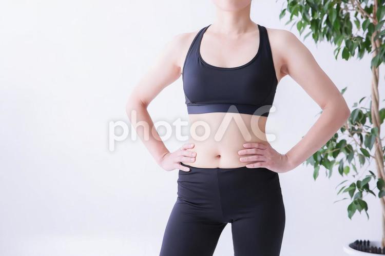 スポーツウェアの美しい女性 ダイエット,運動,お腹の写真素材