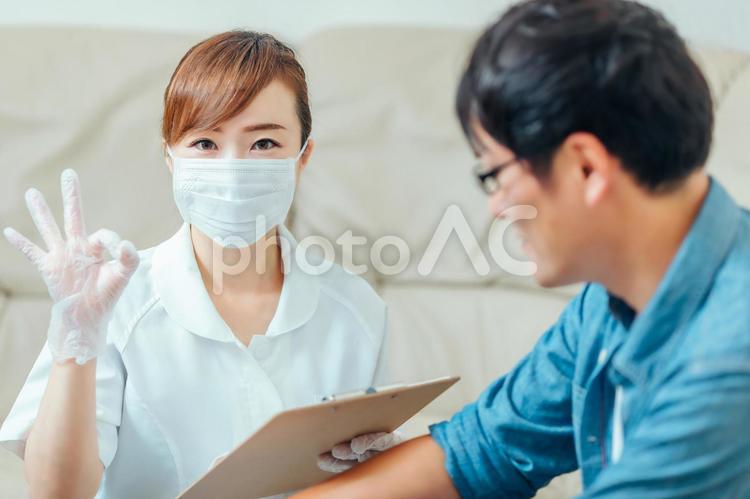 問診する看護師と男性患者 看護師,カウンセリング,問診の写真素材