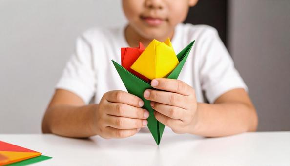 カラフルな折り紙でチューリップを折る幼児 カラフルな折り紙でチューリップを折る幼児の写真