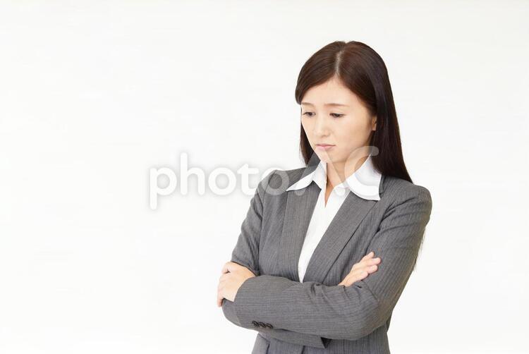 憂鬱な表情のビジネスウーマン 女性,ビジネウーマン,女の写真素材