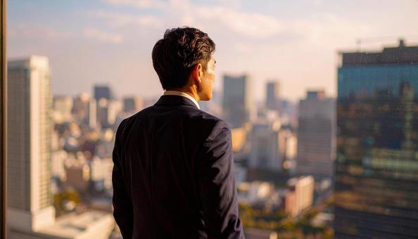 将来を考える日本人ビジネスマンの写真