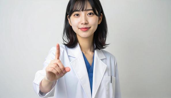 指をさす女医の写真