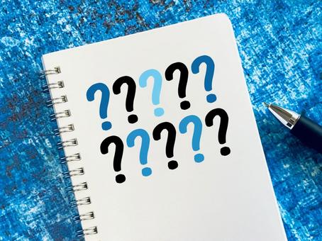 Many question marks written in a notebook, JPG Many question marks written in a notebook, JPG