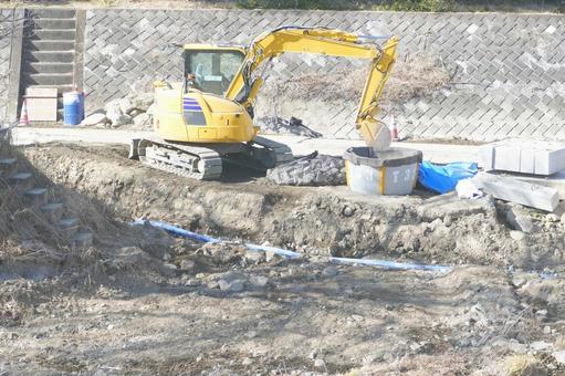 工事現場 工事現場 河川工事,バックホー,堤防の写真素材