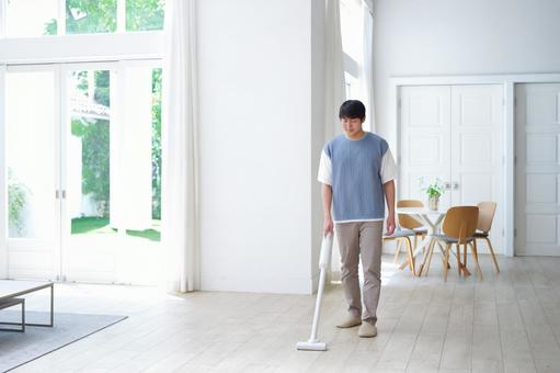 フローリングを掃除機掛けしている男性 男性,家事,掃除の写真素材